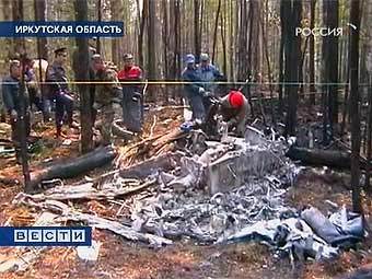 На месте падения вертолета в Иркутской области. Кадр телеканала "Россия"